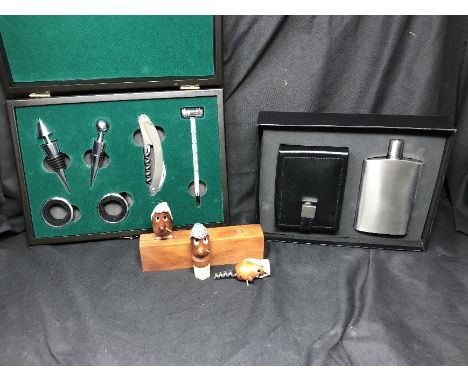 A boxed Dulwich Designs hip flask and cuff-link box, set unused, a cased wine stopper, collar etc. set unused, and a set of f