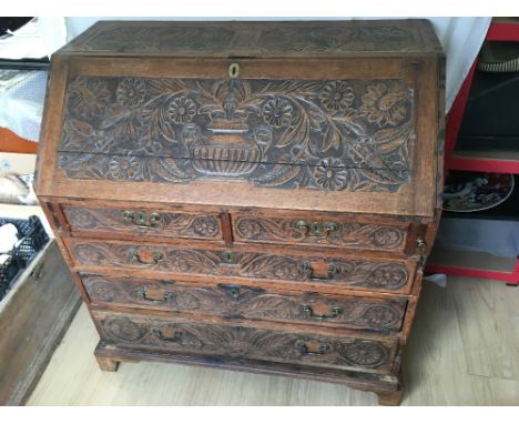 A late 19th Century/early 20th Century fall front bureau. The fall enclosing a fitted interior, above two drawers over three 