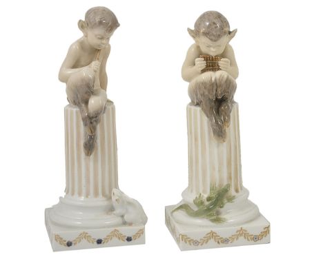 A PAIR OF ROYAL COPENHAGEN FIGURES, EARLY 20TH CENTURY modelled by Christian Thomsen (1860-1921) as fauns atop truncated colu