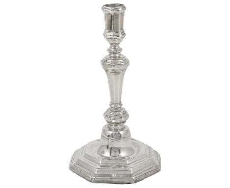 A FRENCH PROVINCIAL SILVER CANDLESTICK, SALOMON RUINAT, GRENOBLE, CIRCA 1725 octagonal, the stepped base engraved to the well