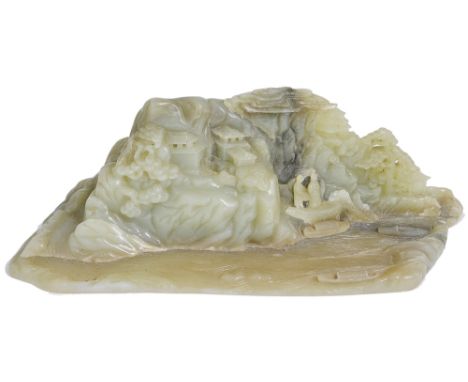 A CHINESE JADE MOUNTAIN, QING DYNASTY carved to the front face with figures standing on stps below a jagged rocky mountain fa