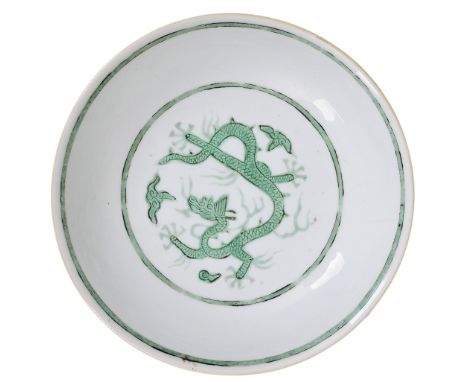 A CHINESE PORCELAIN GREEN ENAMELLED 'DRAGON' SAUCER DISH, QING DYNASTY, 18TH CENTURY the interior with a medallion enclosing 