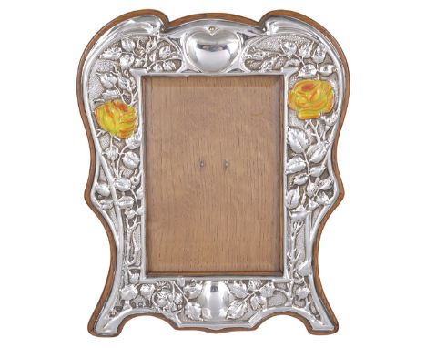 AN EDWARDIAN SILVER PHOTOGRAPH FRAME, W.J. MYATT & CO. LTD., BIRMINGHAM, 1908 shaped oblong, stamped with roses flanking the 
