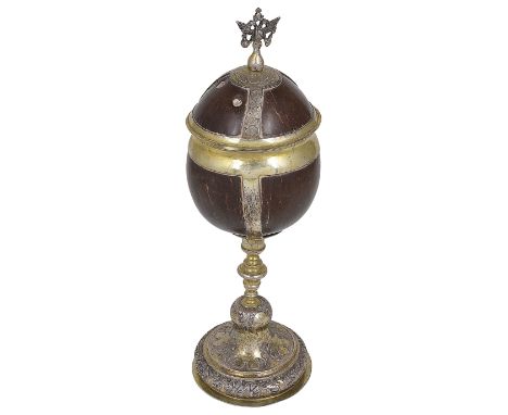 A RUSSIAN PARCEL-GILT-SILVER-MOUNTED COCONUT CUP AND COVER, UNMARKED, MID 18TH CENTURY the circular foot and cover-straps cha