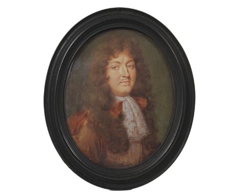 A PORTRAIT MINIATURE OF LOUIS XIV, KING OF FRANCE AND NAVARRE, FRENCH SCHOOL, CIRCA 1670 with a long brown wig, wearing a rus