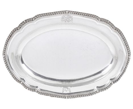 A GEORGE III SILVER MEAT DISH, WILLIAM BENNETT, LONDON, 1807 shaped oval, the border engraved with a coat-of-arms, motto and 