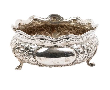 Silver rose bowl of compressed baluster form, with embossed foliate decoration and flared rim, on three pierced feet (Sheffie