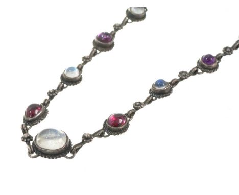 Arts &amp; Crafts silver and gem-set necklace set with moonstone, garnet and amethyst cabochons in rub over settings on a fan