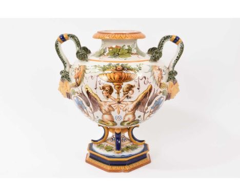 Italian Ginori maiolica vase, with serpent and mask handles, painted with mythical creatures and foliate patterns, marked to 