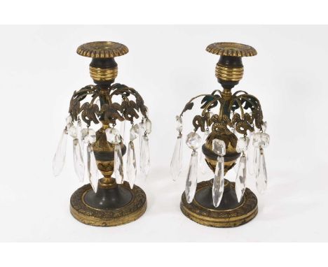 Pair of 19th century bronze candlesticks with cut glass drops, removable sconces on spread bases, 20cm high