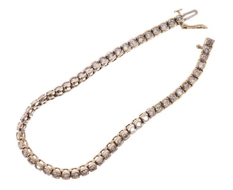 Diamond tennis bracelet with a line of 54 brilliant cut diamonds in 18ct white gold setting. Estimated total diamond weight a
