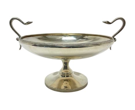 1920s Etruscan revival silver tazza of circular form with twin snake handles and bead border, on a circular pedestal base (Sh