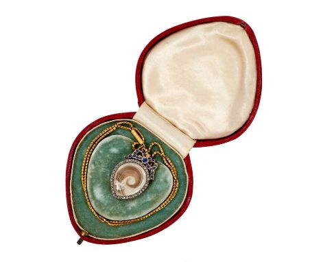 Edwardian heart shaped double sided locket in diamond frame with sapphire ribbon surmount, the reverse containing a portrait 