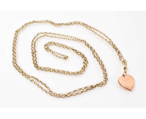 Victorian yellow metal guard chain, 190cm long, with gold heart shaped locket engraved 'Xmas 1909'Total weight 28.8 grams
