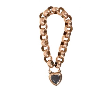 Victorian gold bracelet with large, exaggerated belcher links and a heart shaped padlock clasp with glazed locket compartment