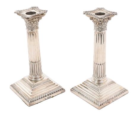 Pair of Edwardian silver Corinthian column candlesticks of typical form, on square stepped bases, separate sconces (Sheffield
