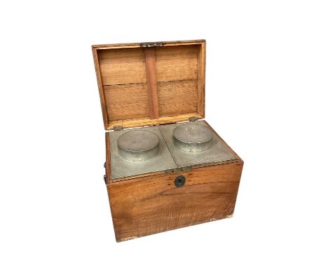 Large 19th century teak cased tea caddy housing twin Chinese engraved lidded pewter canisters, with flanking drop handles, 44