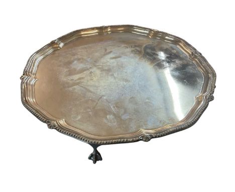 1920s silver salver of hexagonal form, with beaded border, on four ball and claw feet (Sheffield 1926) Harrison Brothers &amp