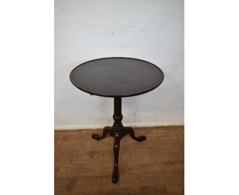 George III mahogany tripod wine table, with dished tilt top on fluted column and tripod cabriole legs and pad feet, 53cm diam
