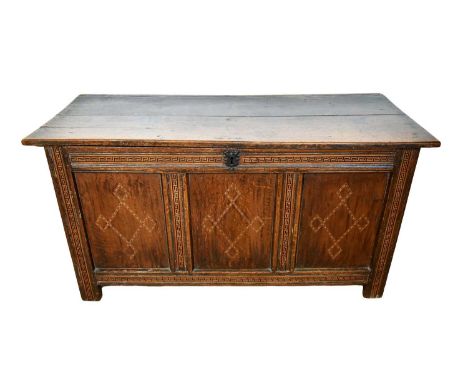 Early 18th century oak and parquetry inlaid coffer, with three panel front, raised on stiles, 134cm wide x 54cm deep x 70cm h