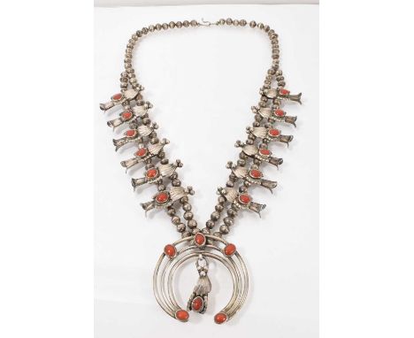 Navajo silver and coral necklace, the silver bead chain with stylised leaf shaped panels set with coral cabochons and a three