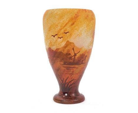 Daum cameo glass vase, early 20th century, decorated with a watery landscape in tones of red, yellow and orange, signed 'Daum