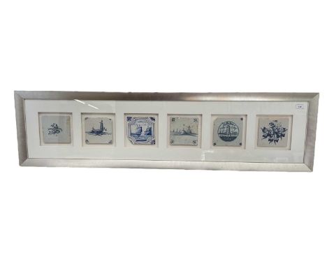 Six 18th century delft tiles mounted in a glazed frame and another single delft tile also in a glazed frame