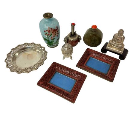 Group of Chinese and Japanese objets d'art, including snuff bottles, cinnabar pin dishes, cloisonné, and silver items