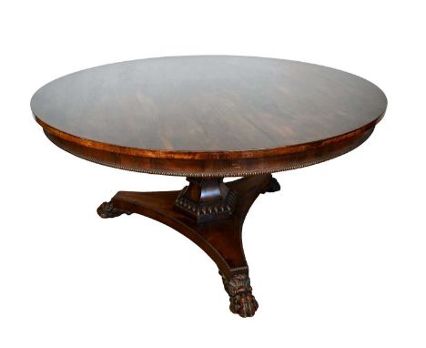 William IV rosewood breakfast table with circular tilt-top, hexagonal column and trefoil base with paw feet, 137cm diameter