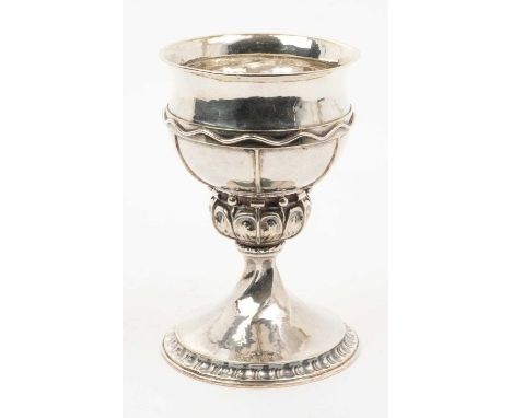 1920s Arts and Crafts silver goblet, with spot hammered finish, the circular bowl, with applied wirework decoration and flare