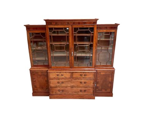 George III mahogany two-height breakfront bookcase with moulded cornice and astragal glazed doors enclosing adjustable shelve