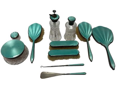 Composite 1930s silver dressing table set, with green guilloche enamel decoration, comprising two pairs brushes, hand mirror,