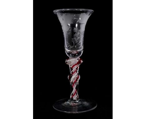 Continental red colour twist wine glass, circa 1780, the bell bowl etched with grapevines, on a double-knopped stem containin