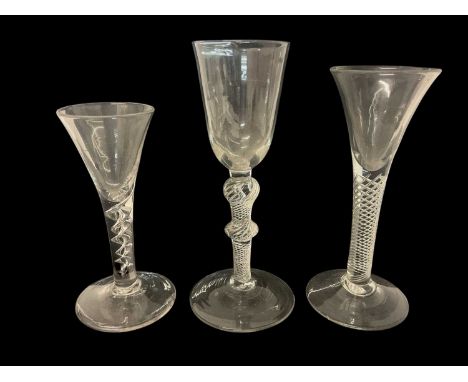 Three mid 18th century air twist wine glasses, including one corkscrew twist, and two multi spiral, 13.75cm to 17.75cm high (