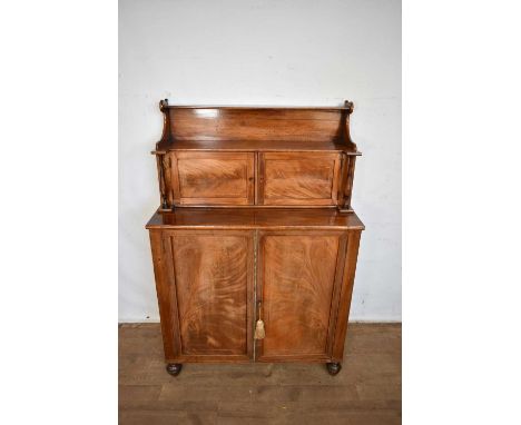 Regency mahogany chiffonier, with two cupboards to the waterfall superstructure and adjustable shelves enclosed by two cupboa