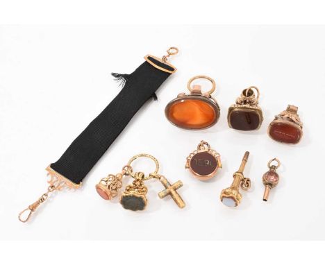 Group of 19th century seals/fobs to include a Regency yellow metal seal with armorial intaglio carved bloodstone, two winding