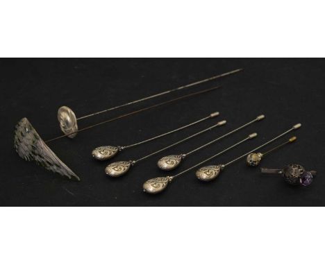 Group of hat pins, etc comprising five matching white metal hat pins, a silver hat pin in the form of a flower, and a large w