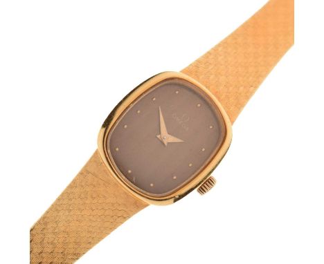 Omega - Lady 1970s 18ct gold stamped '750' bracelet watch, 511.8436, the copper brown oval dial with gilt dot hour markers an