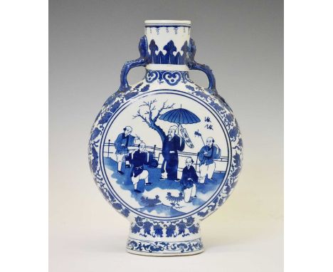 Reproduction blue and white porcelain moon flask, of typical form, painted with figures in a garden within foliate borders, 3