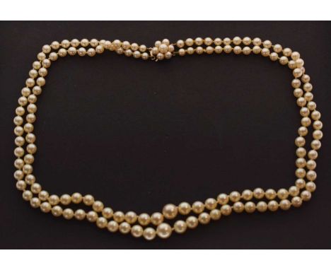 Cultured pearl two-row graduated necklace, the 9ct gold and pearl clasp in the form of a flower, 46cm long approx, the two la