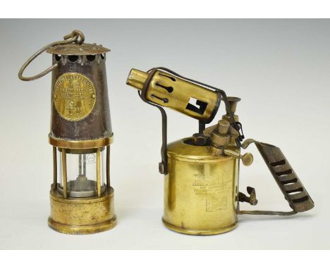 The Protector Lamp and Lighting Co. Ltd. Type SL miner's safety lamp, no. 49, together with a Bladon blowlamp, 22.5cm high an
