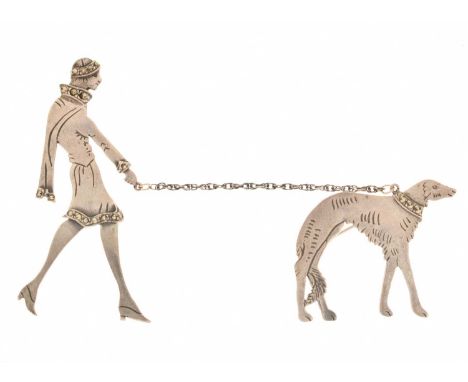 Art Deco-style brooch, depicting a lady walking a Borzoi dog on a chain lead, having marcasite decoration, indistinctly stamp