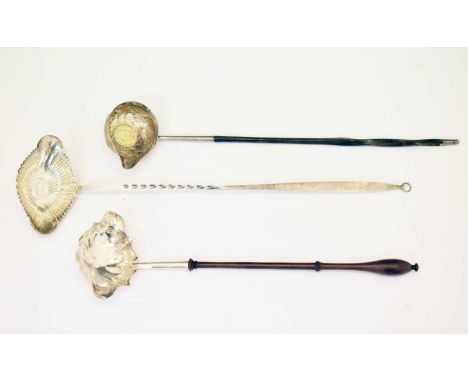 Three silver toddy ladles; a white-metal ladle inset with a George II shilling and a baleen-handle, a Victorian silver ladle 