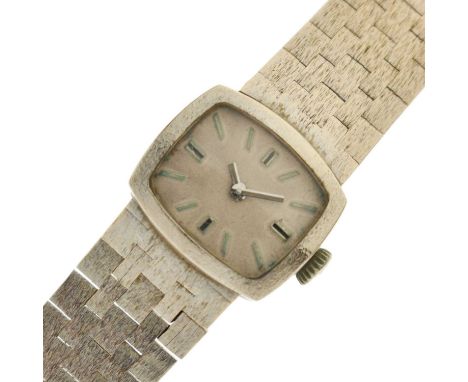 Lady's vintage '14K' white gold bracelet watch, the unsigned silvered dial with applied baton hour markers, unsigned crown an