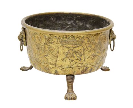 Early 20th century Dutch brass planter with two lion mark ring handles and foliate scroll and sailing ship repoussé decoratio