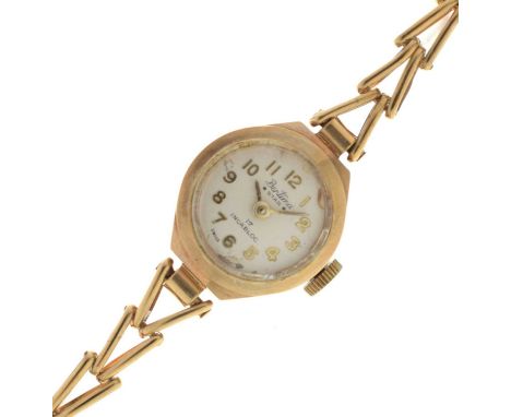Bentima - Lady's vintage 9ct gold cocktail watch (gold-plated case back), the silvered dial with applied gilt Arabic hour mar