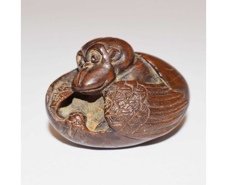 Japanese netsuke of a tengu hatching out of its egg, indistinctly signed, 4.5cm long