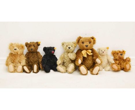 Steiff - Group of seven various sized teddy bears to include golden mohair examples, all with yellow labels to ear, 43cm high
