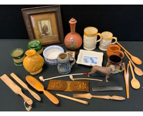 An early 20th century photograph, policeman, ornate frame, 33.5cm x 28.5cm overall;   studio pottery vase, Wrestling the Lion