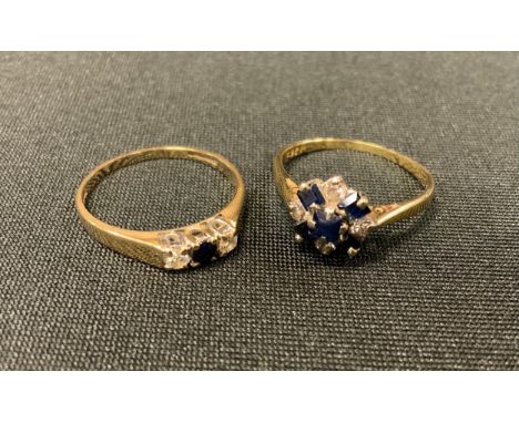 An 18ct gold diamond and sapphire cluster ring, size K,  stamped 18ct, 2.3g;  a similar 9ct gold trilogy ring, size K, 1.5g g